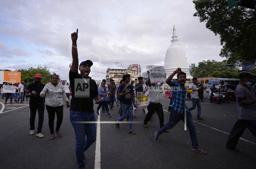 Eranga Jayawardena Members of Socialist Youth Union shout slogans and march towards Sri Lanka's police headquarters during a protest in Colombo, Sri Lanka, Monday, May 16, 2022. Sri Lanka’s prime minister on Monday proposed to privatize the country’s loss-making national carrier as part of reforms to solve the country worst economic crisis in recent memory. (AP Photo/Eranga Jayawardena)
