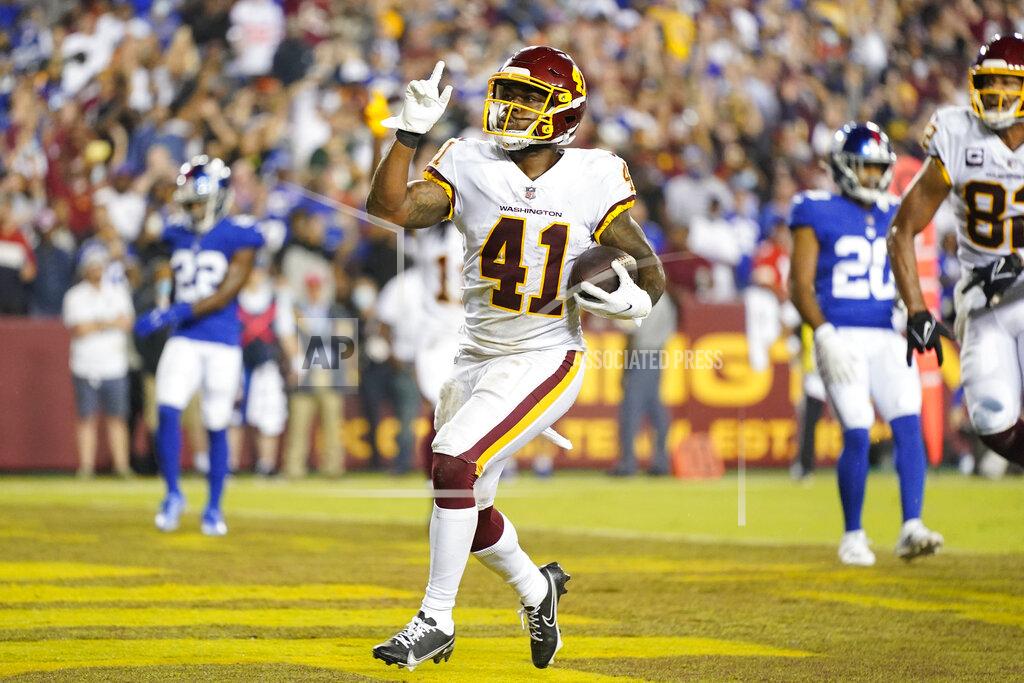Patrick Semansky Washington Football Team running back J.D. McKissic (41) gesturing as he scores a touchdown against the New York Giants during the first half of an NFL football game, Thursday, Sept. 16, 2021, in Landover, Md. (AP Photo/Patrick Semansky)