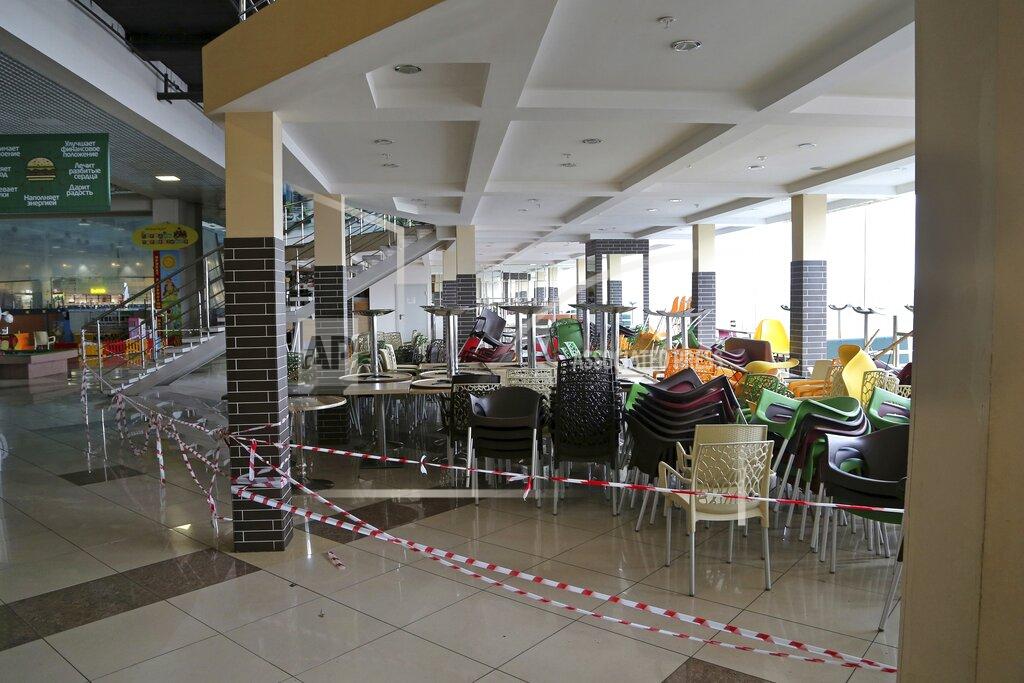 Yuri Strelets A closed cafe is seen inside an empty shopping mall closed due to a spike in contagion of coronavirus in Samara, Russia, Monday, Oct. 25, 2021. The Samara region was one of the first of Russia's 85 regions to enter a nonworking period Monday, a measure ordered by the Kremlin to stem the spread of infection as the country faces a spike in contagion. (AP Photo/Yuri Strelets)