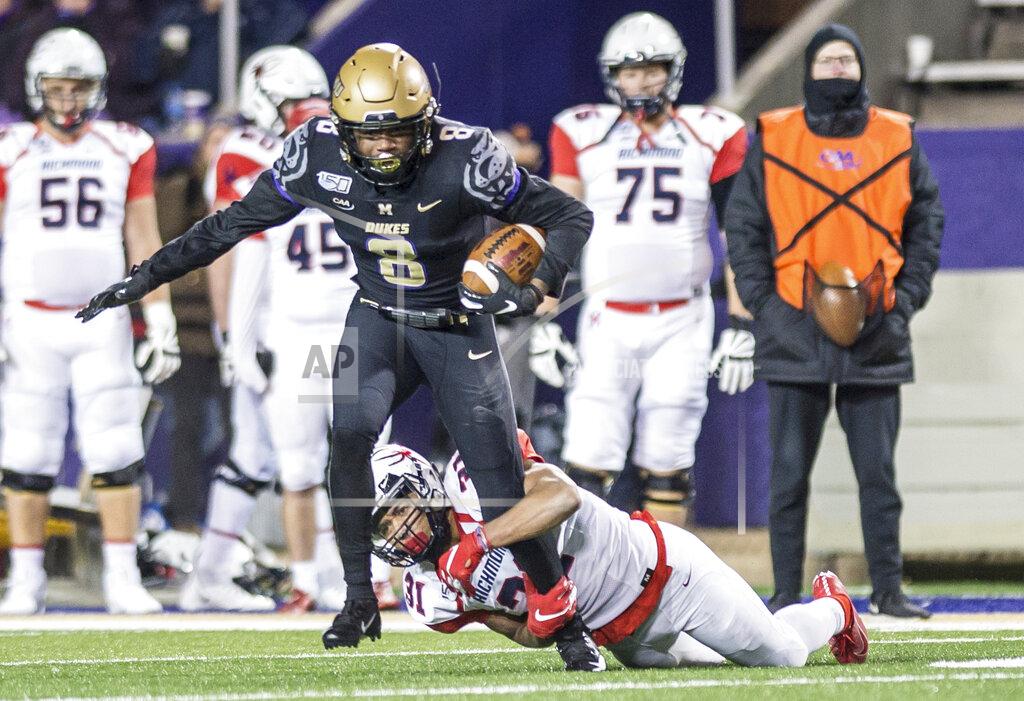 Daniel Lin James Madison safety Wayne Davis (8) tries to escape from Richmond running back Savon Smith (31) after making an interception during the second half of an NCAA college football game in Harrisonburg, Va, Saturday, Nov. 16, 2019. (Daniel Lin/Daily News-Record via AP)