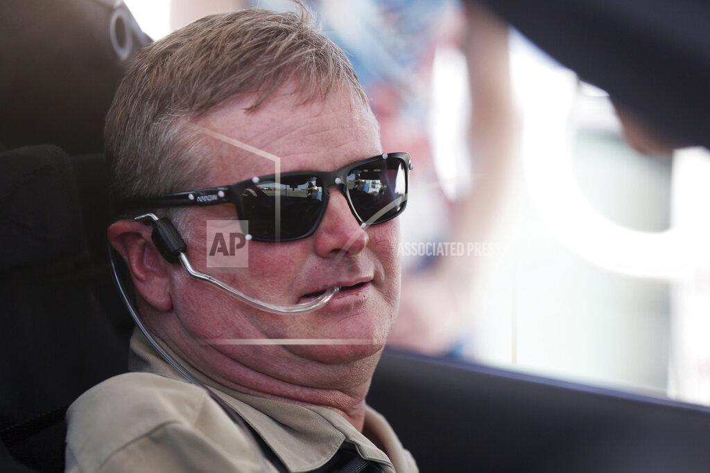 Isaac Brekken FILE - In this Sept. 27, 2016, file photo, Sam Schmidt prepares to drive his modified Corvette in Las Vegas. McLaren will return to full-time IndyCar competition next season for the first time since 1979 in a partnership with existing team Arrow Schmidt Peterson Motorsports. Arrow Electronics will remain the team's title partner and team co-founders Sam Schmidt and Ric Peterson will continue in their current leadership roles. (AP Photo/Isaac Brekken, File)