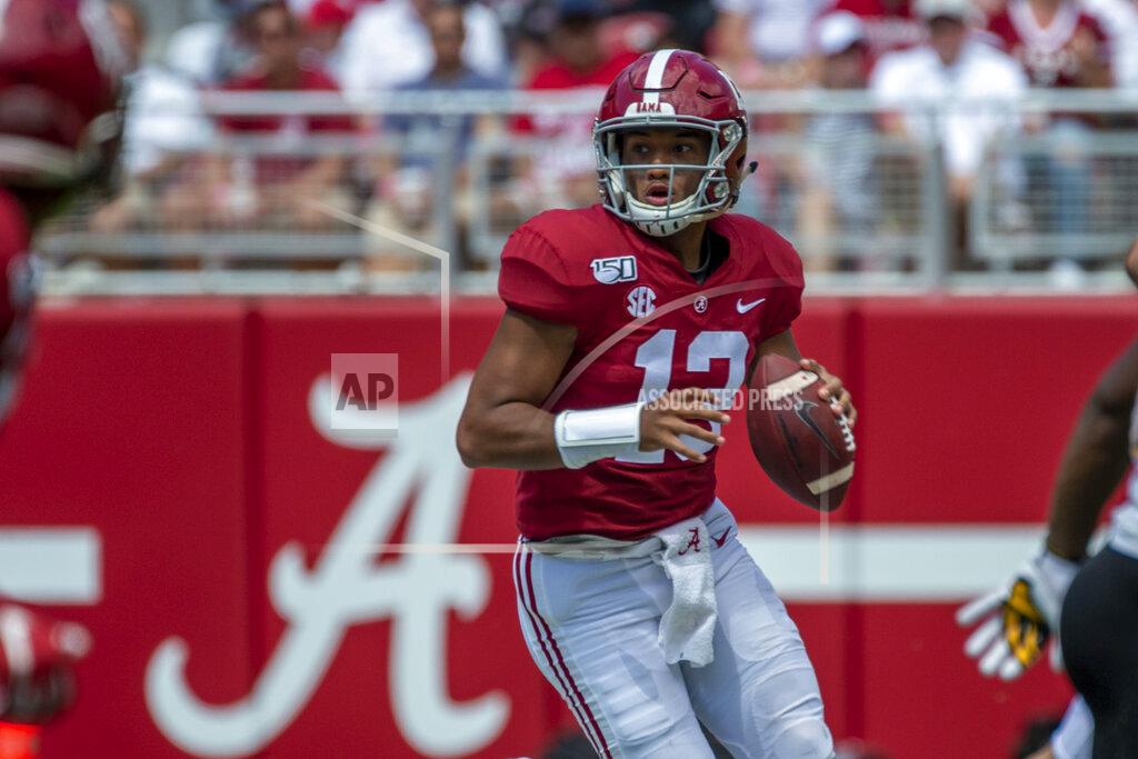 Vasha Hunt Alabama quarterback Tua Tagovailoa (13) rolls out to throw against Southern Miss during the second half of an NCAA college football game, Saturday, Sept. 21, 2019, in Tuscaloosa, Ala. (AP Photo/Vasha Hunt)