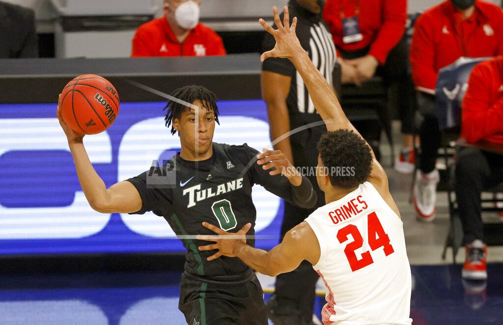 Ron Jenkins Tulane guard Gabe Watson (0) looks to pass around Houston guard Quentin Grimes (24) during the first half of an NCAA college basketball game in the quarterfinal round of the American Athletic Conference men's tournament Friday, March 12, 2021, in Fort Worth, Texas. (AP Photo/Ron Jenkins)