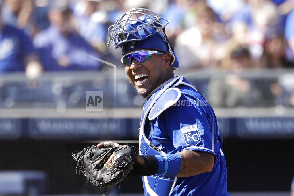Elaine Thompson FILE - In this Wednesday, March 4, 2020, file photo, Kansas City Royals catcher Salvador Perez smiles as he turns to a teammate who made an out on a difficult play against the San Diego Padres in the first inning during a spring training baseball game in Peoria, Ariz. (AP Photo/Elaine Thompson, File)