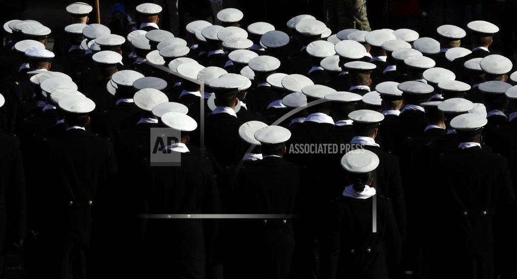 Matt Slocum Navy midshipmen march onto the field before an NCAA college football game against Army, Saturday, Dec. 8, 2018, in Philadelphia. (AP Photo/Matt Slocum)