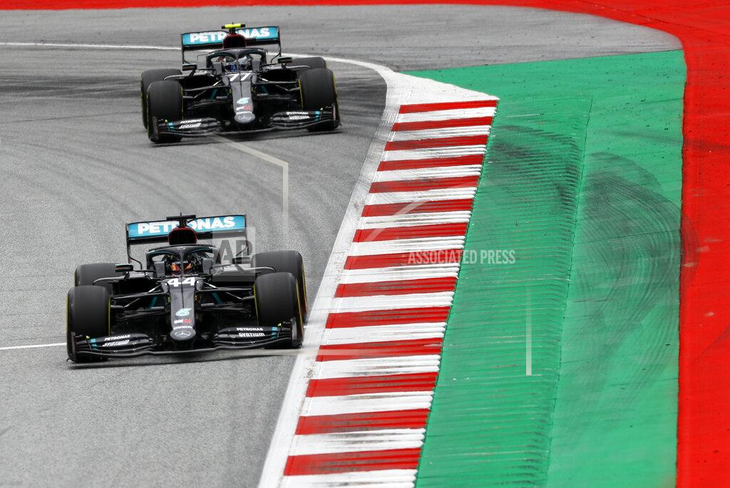 Leonhard Foeger Mercedes driver Lewis Hamilton of Britain steers his car followed by Mercedes driver Valtteri Bottas of Finland during the second practice session at the Red Bull Ring racetrack in Spielberg, Austria, Friday, July 3, 2020. The Austrian Formula One Grand Prix will be held on Sunday. (Leonhard Foeger/Pool via AP)