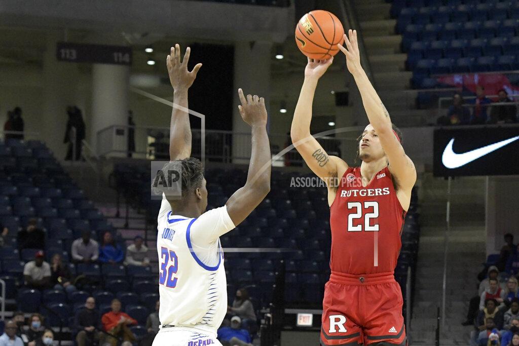 Mark Black Rutgers' Caleb McConnell (22) shoots over DePaul's David Jones (32) during the first half of an NCAA college basketball game Thursday, Nov. 18, 2021, in Chicago. (AP Photo/Mark Black)