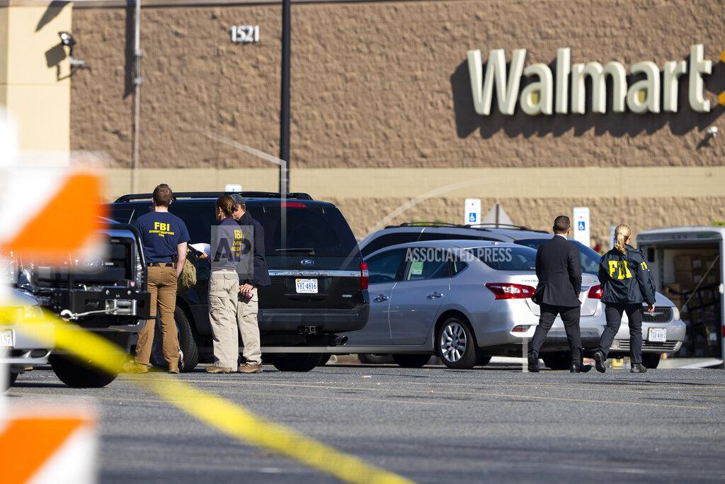 Alex Brandon Law enforcement, including the FBI, work at the scene of a mass shooting at a Walmart, Wednesday, Nov. 23, 2022, in Chesapeake, Va. A Walmart manager opened fire on fellow employees in the break room of the Virginia store, killing several people in the country’s second high-profile mass shooting in four days, police and witnesses said Wednesday. (AP Photo/Alex Brandon)