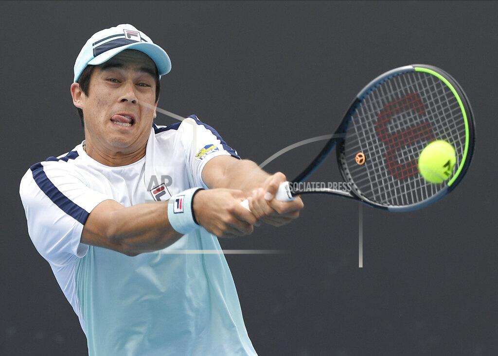 Andy Brownbill United States' Mackenzie McDonald makes a backhand return to Croatia's Borna Coric during their second round match at the Australian Open tennis championship in Melbourne, Australia, Thursday, Feb. 11, 2021.(AP Photo/Andy Brownbill)