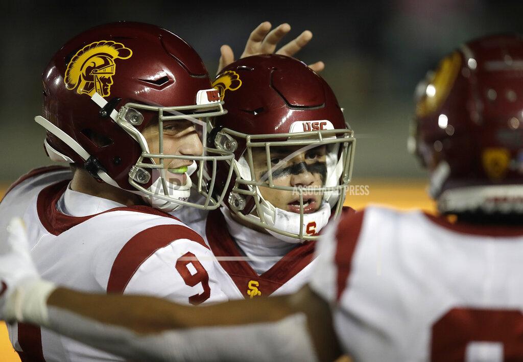 Ben Margot Southern California quarterback Kedon Slovis (9) celebrates with Drake London after London's touchdown against California in the second half of an NCAA college football game Saturday, Nov. 16, 2019, in Berkeley, Calif. (AP Photo/Ben Margot)
