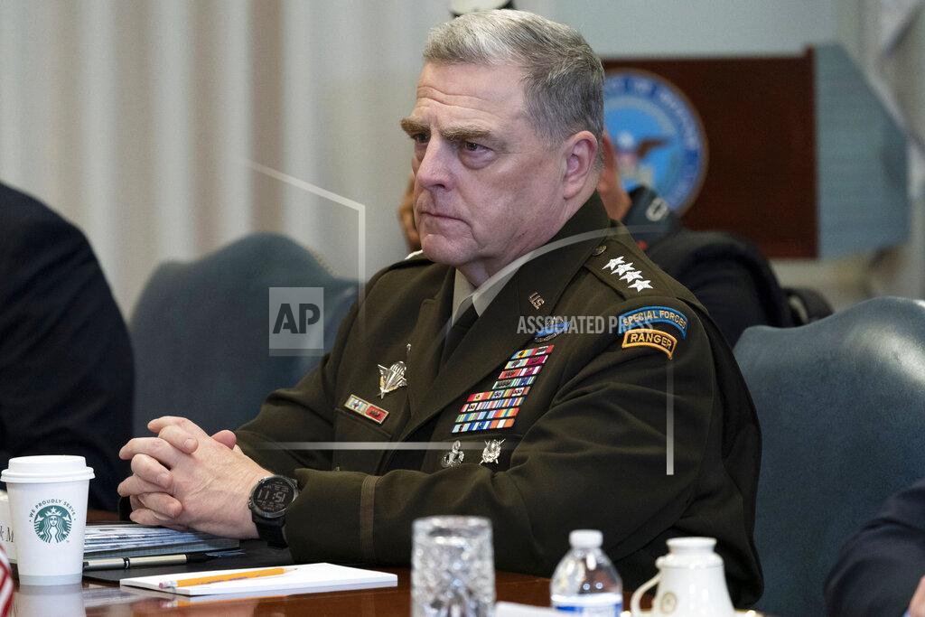 FILE - In this Sept. 22, 2020, file photo Joint Chiefs Chairman Gen. Mark Milley listens before a meeting with Secretary of Defense Mark Esper and Israeli Defense Minister Benny Gantz, at the Pentagon in Washington. The nation's top military leaders were under self-quarantine Tuesday, Oct. 6, after a senior Coast Guard official tested positive for the coronavirus, the Pentagon said. Milley, and the vice chairman, Gen. John Hyten, were among those affected, U.S. officials said. (AP Photo/Alex Brandon, File)