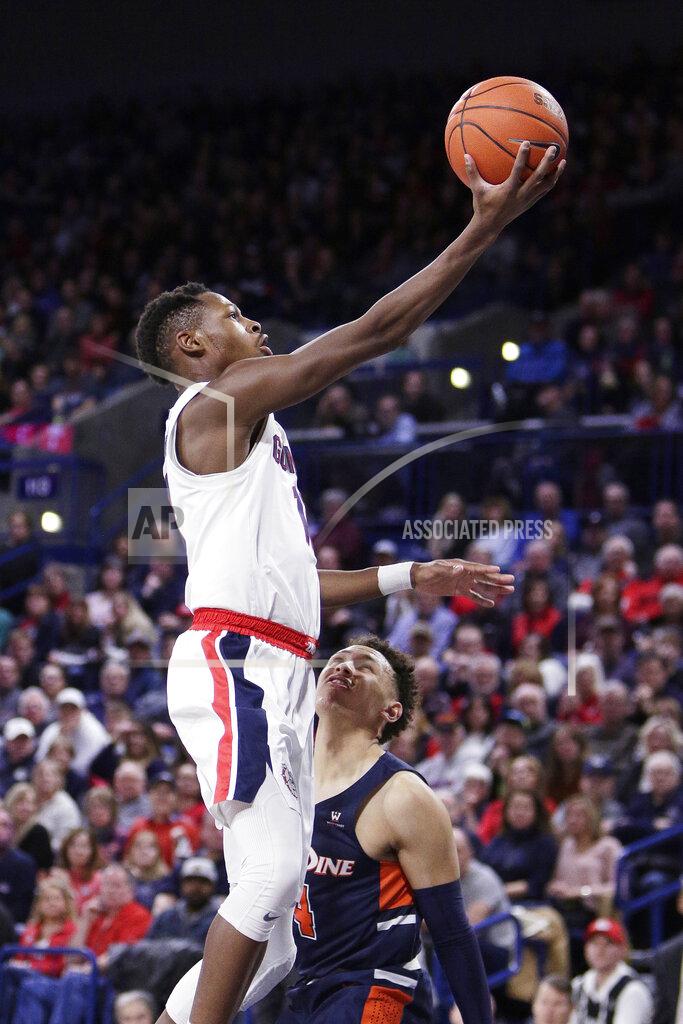 Young Kwak Gonzaga guard Joel Ayayi, left, shoots over Pepperdine guard Colbey Ross during the first half of an NCAA college basketball game in Spokane, Wash., Saturday, Jan. 4, 2020. (AP Photo/Young Kwak)