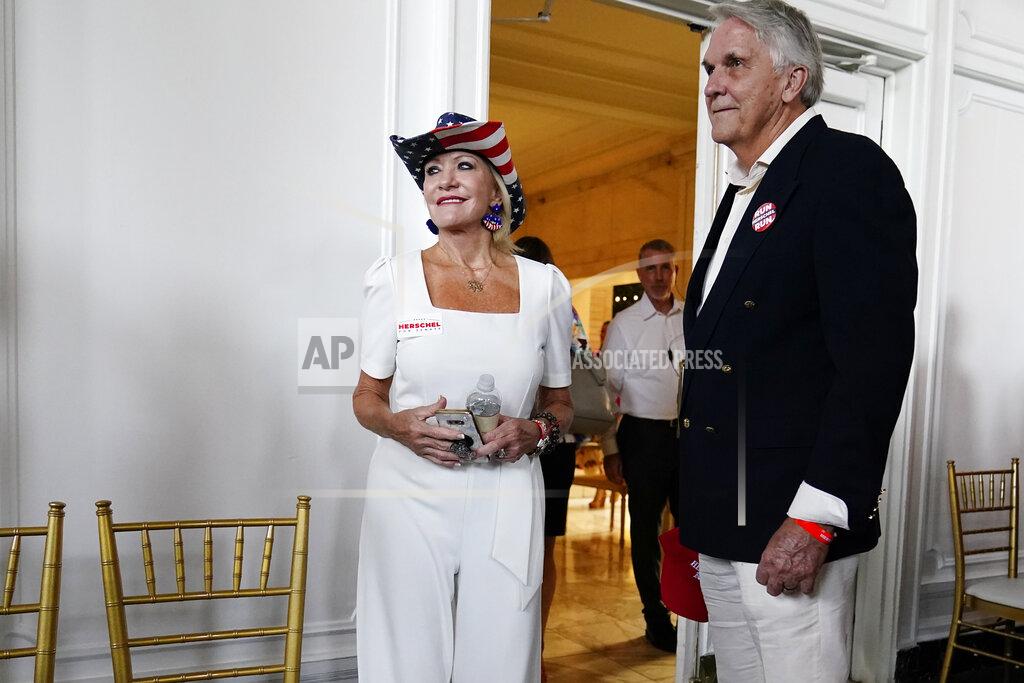 Brynn Anderson Supporters arrive for an election night watch party for U.S. Senate candidate Herschel Walker, during Georgia's primary election, Tuesday, May 24, 2022, in Atlanta. (AP Photo/Brynn Anderson)