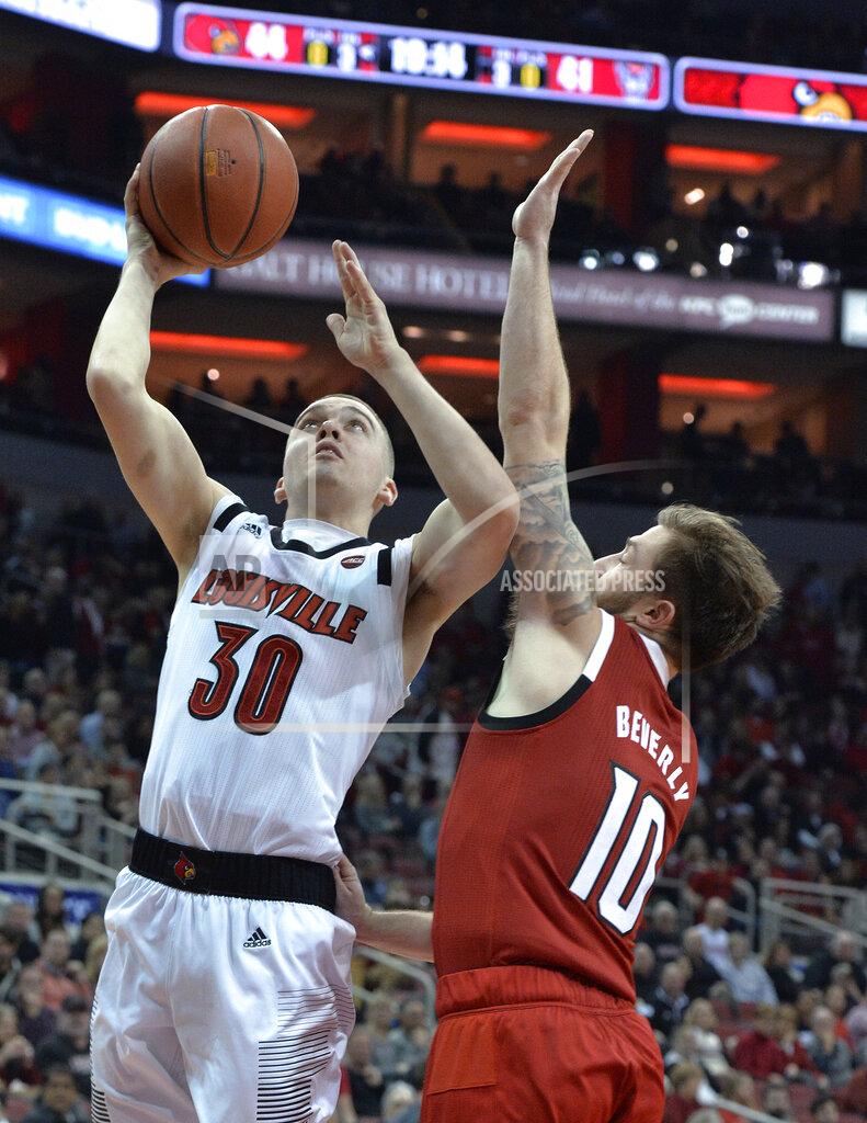 Timothy D. Easley Louisville guard Ryan McMahon (30) shoots next to North Carolina State guard Braxton Beverly (10) during the second half of an NCAA college basketball game in Louisville, Ky., Thursday, Jan. 24, 2019. Louisville won 84-77. (AP Photo/Timothy D. Easley)