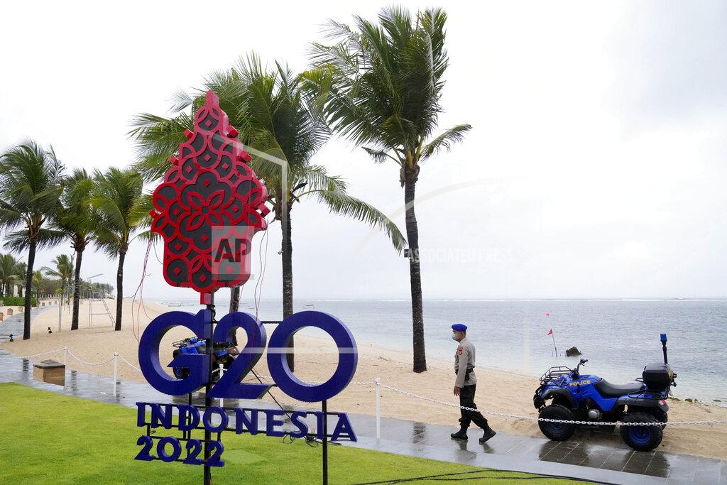 Dita Alangkara A police officer walks past a G20 sign in Nusa Dua, Bali, Indonesia, Thursday, July 7, 2022. Foreign ministers from the Group of 20 leading rich and developing nations are gathering in Indonesia's resort island of Bali for talks bound to be dominated by the conflict in Ukraine despite an agenda focused on global cooperation and food and energy security. (AP Photo/Dita Alangkara)