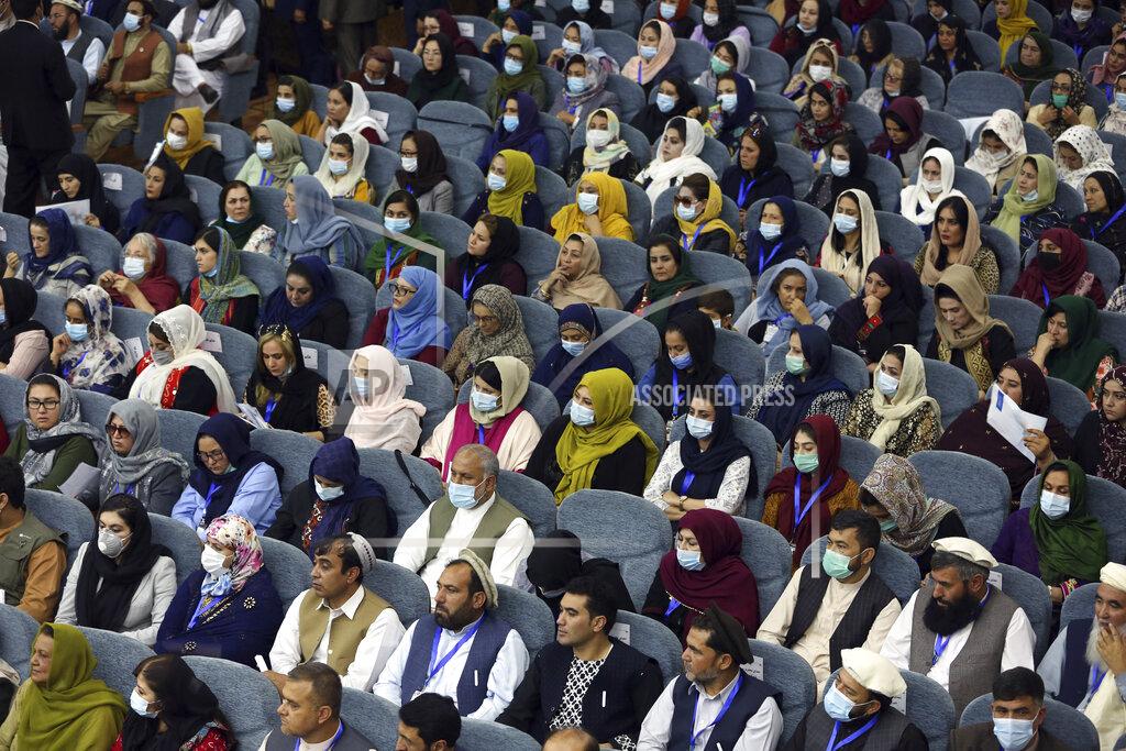 Rahmat Gul Delegates wearing a protective face masks to help curb the spread of the coronavirus attend an Afghan Loya Jirga meeting in Kabul, Afghanistan, Friday, Aug. 7, 2020. The traditional council opened Friday in the Afghan capital to decide the release of a final 400 Taliban - the last hurdle to the start of negotiations between Kabul’s political leadership and the Taliban in keeping with a peace deal the United States signed with the insurgent movement in February. (AP Photo/Rahmat Gul)