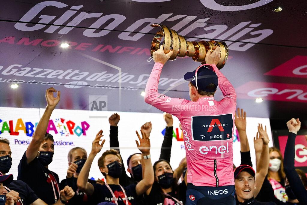 Marco Alpozzi Britain’s Tao Geoghegan Hart celebrates with teammates after winning the Giro d'Italia cycling race, in Milan, Italy, Sunday, Oct. 25, 2020. In one of the most exciting final stages of a Grand Tour, British rider Tao Geoghegan Hart won the Giro d’Italia on Sunday, edging out Australian Jai Hindley by just 39 seconds. (Marco Alpozzi/LaPresse via AP)