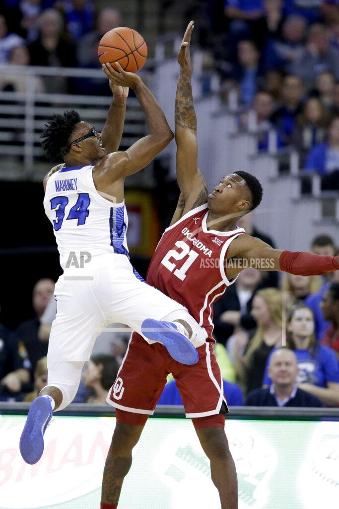 Nati Harnik Creighton's Denzel Mahoney (34) shoots against the defense of Oklahoma's Kristian Doolittle (21) during the first half of an NCAA college basketball game in Omaha, Neb., Tuesday, Dec. 17, 2019. (AP Photo/Nati Harnik)