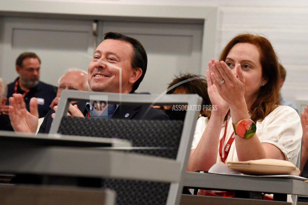 Meg Kinnard South Carolina Republican Party Chairman Drew McKissick, left, and his wife Amy, right, applaud during remarks by Gov. Henry McMaster during the Richland County GOP convention on Friday, April 30, 2021, in Columbia, S.C. (AP Photo/Meg Kinnard)