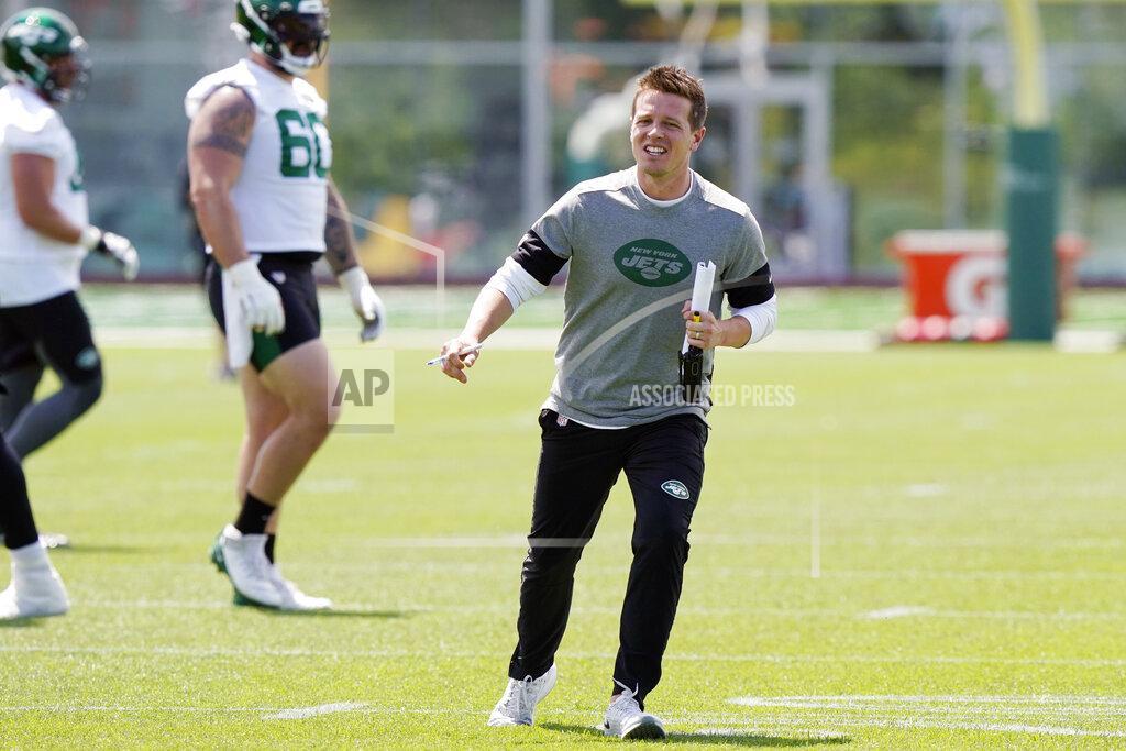 Kathy Willens FILE - In this May 27, 2021, file photo, New York Jets offensive coordinator Mike LaFleur directs his players during an NFL football practice in Florham Park, N.J. LaFleur was still a teenager living at home when his big brother would bring his buddy over so they could raid the family's refrigerator and intercept the TV remote. (AP Photo/Kathy Willens, File)
