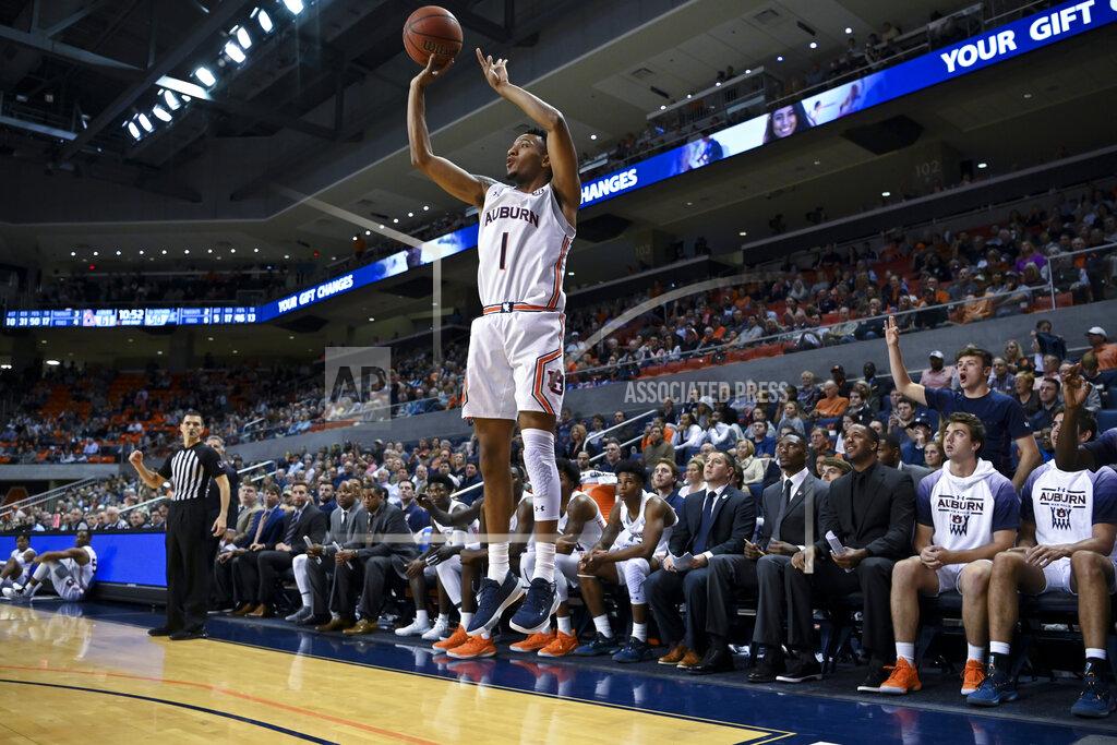 Julie Bennett Auburn guard Jamal Johnson (1) shoots for three points against Georgia Southern during the second half of an NCAA college basketball game Tuesday, Nov. 5, 2019, in Auburn, Ala. (AP Photo/Julie Bennett)