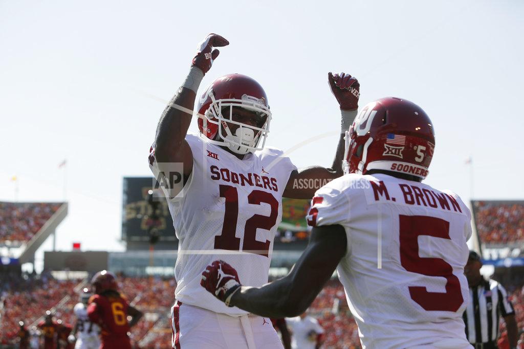 Matthew Putney Oklahoma wide receiver A.D. Miller, left, celebrates a touchdown by Marquise Brown, right, during the first half of an NCAA college football game against Iowa State, Saturday, Sept. 15, 2018, in Ames, Iowa. (AP Photo/Matthew Putney)