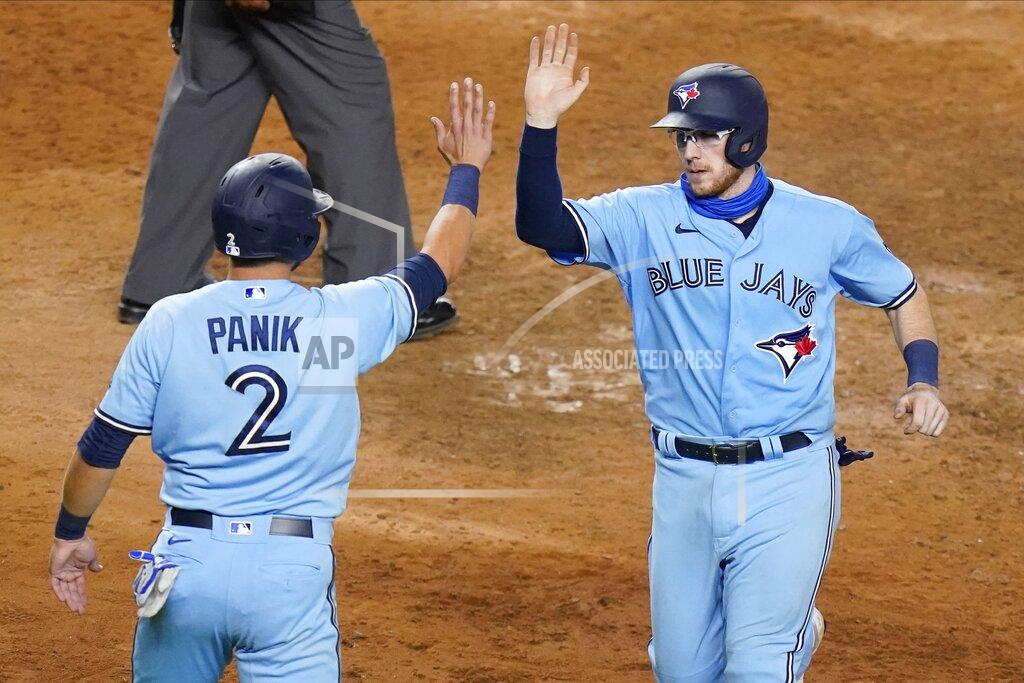 Frank Franklin Ii Toronto Blue Jays' Danny Jansen, right, celebrates with Joe Panik after they scored on a single by Bo Bichette during the ninth inning of a baseball game against the New York Yankees Thursday, Sept. 17, 2020, in New York. The Yankees won 10-7. (AP Photo/Frank Franklin II)