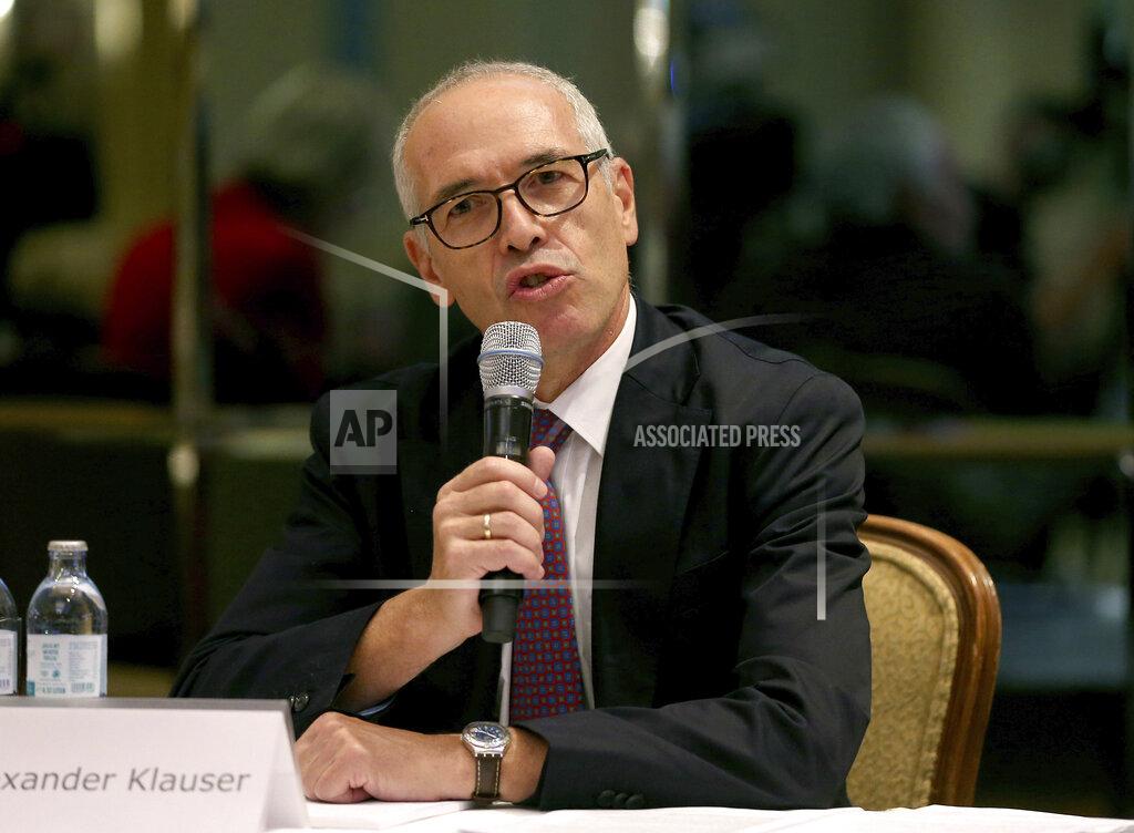 Ronald Zak Attorney Alexander Klauser speakes during a press conference of a class action lawsuit against the Tirol regional authorities for failing in their public health duties, related to the virus outbreak in the ski-resort of Ischgl, seen as a key location from which the virus spread across Europe, in Vienna, Austria, Wednesday, Sept. 23, 2020. (AP Photo/Ronald Zak)