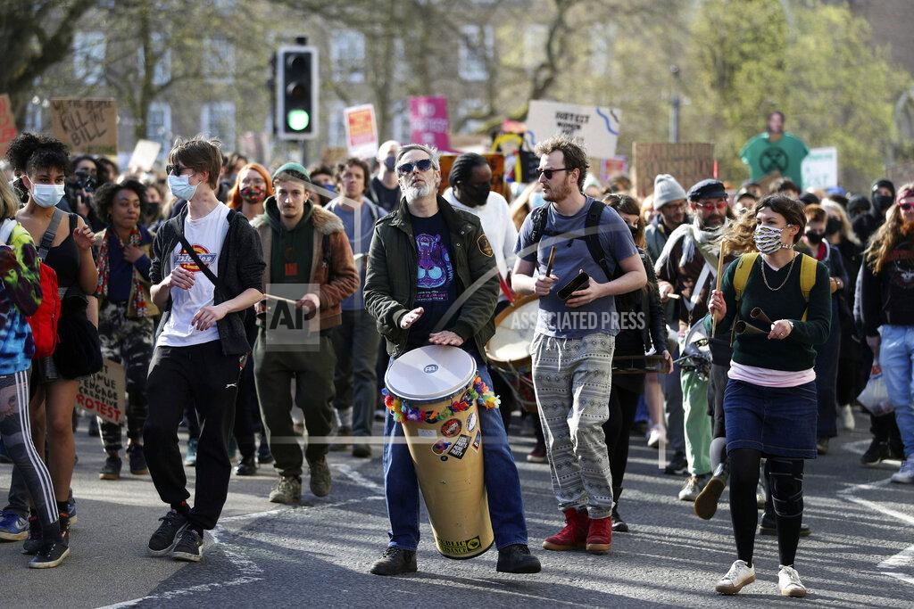 Andrew Matthews Demonstrators march during a 'Kill the Bill' protest in Bristol, England, Saturday, April 3, 2021. The demonstration is against the contentious Police, Crime, Sentencing and Courts Bill, which is currently going through Parliament and would give police stronger powers to restrict protests. (Andrew Matthews/PA via AP)
