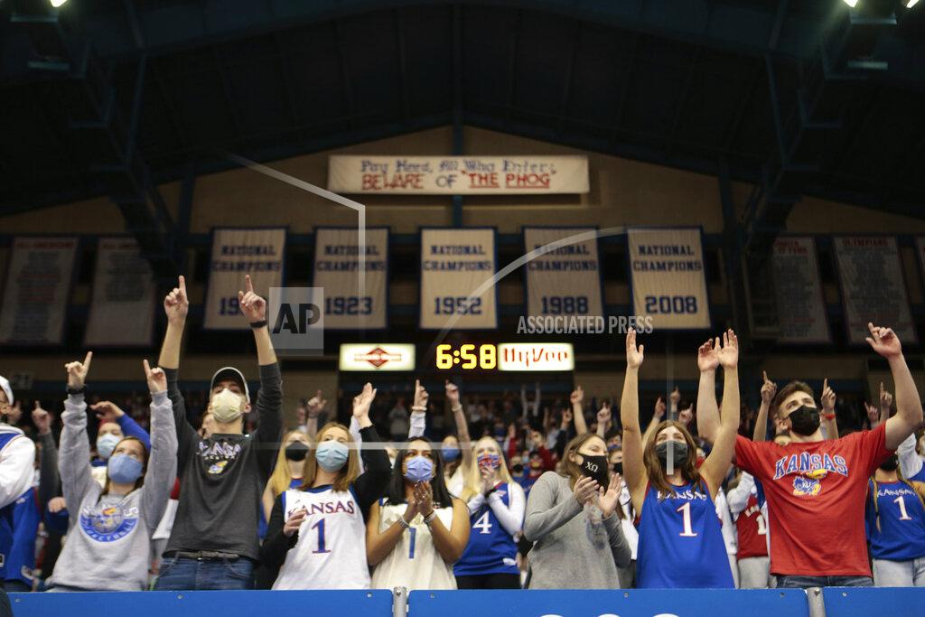 Evert Nelson Kansas fans jump up and yell before the tipoff of the team's NCAA college basketball game against Baylor ojn Saturday, Feb. 27, 2021, in Lawrence, Kan. (Evert Nelson/The Topeka Capital-Journal via AP)