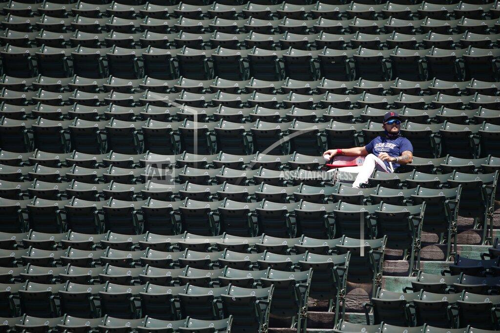Michael Dwyer Boston Red Sox's Michael Chavis sits next to the red seat in the bleachers that signifies the longest home run ever hit at Fenway Park, by Ted Williams in 1946, during baseball practice Sunday, July 5, 2020, in Boston. (AP Photo/Michael Dwyer)