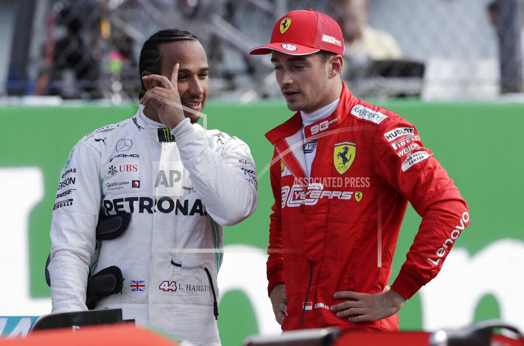 Luca Bruno Ferrari driver Charles Leclerc of Monaco, right, talks with Mercedes driver Lewis Hamilton of Britain after the qualifying session at the Monza racetrack, in Monza, Italy, Saturday, Sept. 7, 2019. The Formula one race will be held on Sunday. (AP Photo/Luca Bruno)