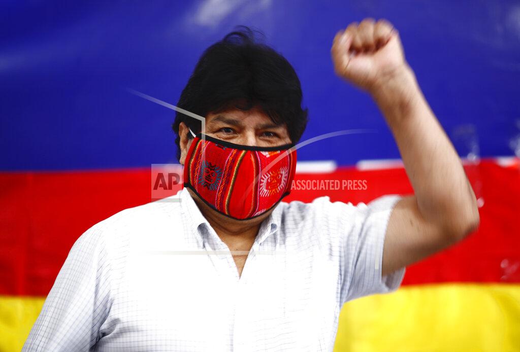 Marcos Brindicci Former Bolivian President Evo Morales raises his fist as he arrives for a press conference at Movement Towards Socialism (MAS) headquarters in Buenos Aires, Argentina, during general elections in his home country, Sunday, Oct. 18. 2020. (AP Photo/Marcos Brindicci)