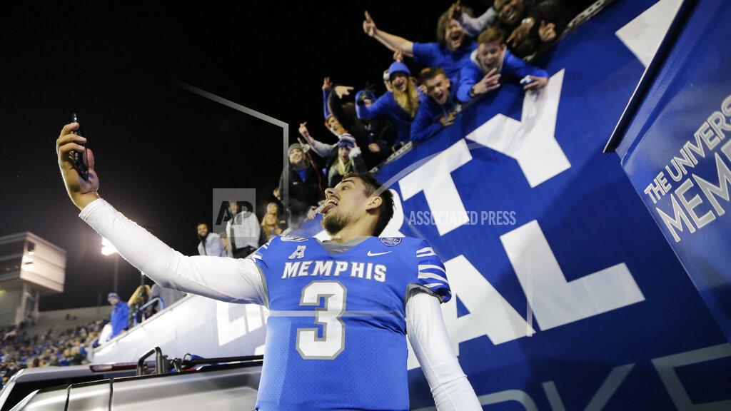 Mark Humphrey Memphis quarterback Brady White takes a selfie with a fan's phone after the team's NCAA college football game against SMU on Saturday, Nov. 2, 2019, in Memphis, Tenn. Memphis won 54-48. (AP Photo/Mark Humphrey)