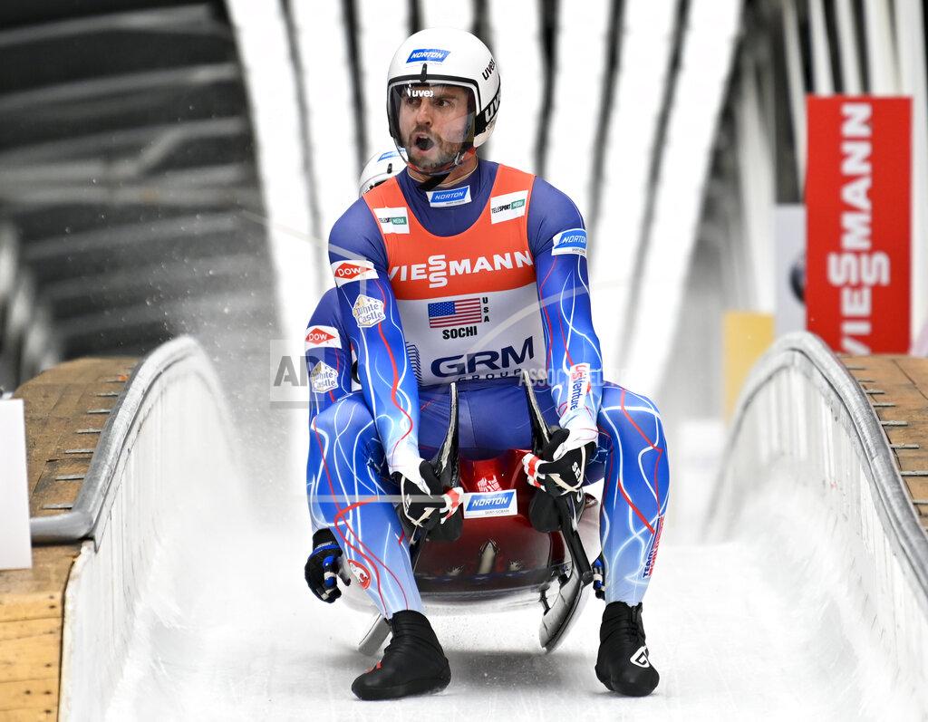 Chris Mazdzer and Jayson Terdiman of United States finish their team relay race at the World Luge Championships in Krasnaya Polyana, near the Black Sea resort of Sochi, southern Russia, Sunday, Feb. 16, 2020. (AP Photo/Artur Lebedev)