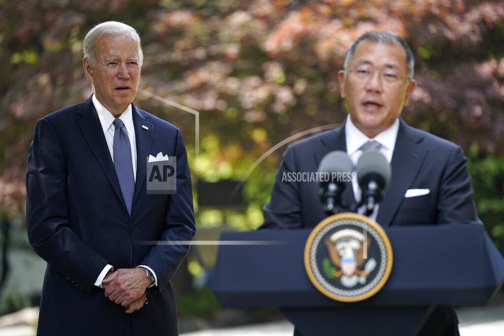 Evan Vucci U.S. President Joe Biden, left, listens to Hyundai Motor Group Executive Chair Euisun Chung, at the Grand Hyatt Seoul, Sunday, May 22, 2022, in Seoul. (AP Photo/Evan Vucci)