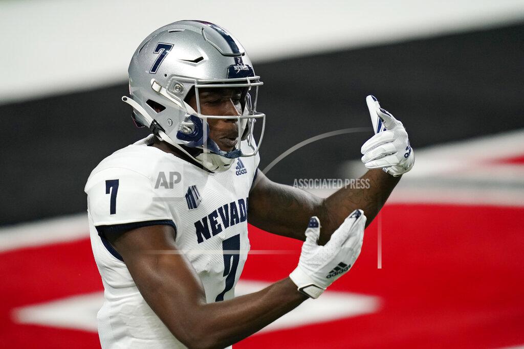 John Locher Nevada wide receiver Romeo Doubs (7) celebrates after scoring a touchdown against UNLV during the first half of an NCAA college football game Saturday, Oct. 31, 2020, in Las Vegas. (AP Photo/John Locher)