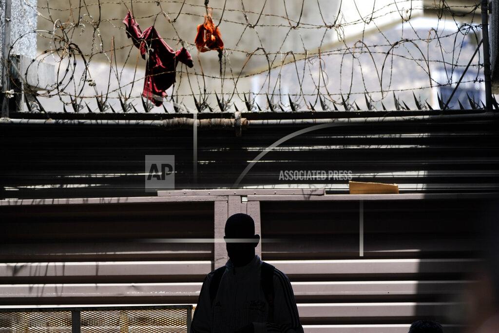 Gregory Bull FILE - A migrant from Haiti waits with others at a clinic for migrants in Tijuana, Monday, May 23, 2022. The Supreme Court has ruled that the Biden administration properly ended a Trump-era policy forcing some U.S. asylum-seekers to wait in Mexico. The justices’ 5-4 decision for the administration came in a case about the “Remain in Mexico” policy under President Donald Trump. (AP Photo/Gregory Bull, File)