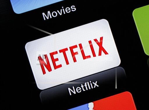 FILE - This June 24, 2015, file photo, shows the Netflix Apple TV app icon in South Orange, N.J. Netflix is raising prices for its video streaming customers in the U.S. and Canada, less than a year and a half since its last price increase, as competition from other streaming services increases. (AP Photo/Dan Goodman, File)