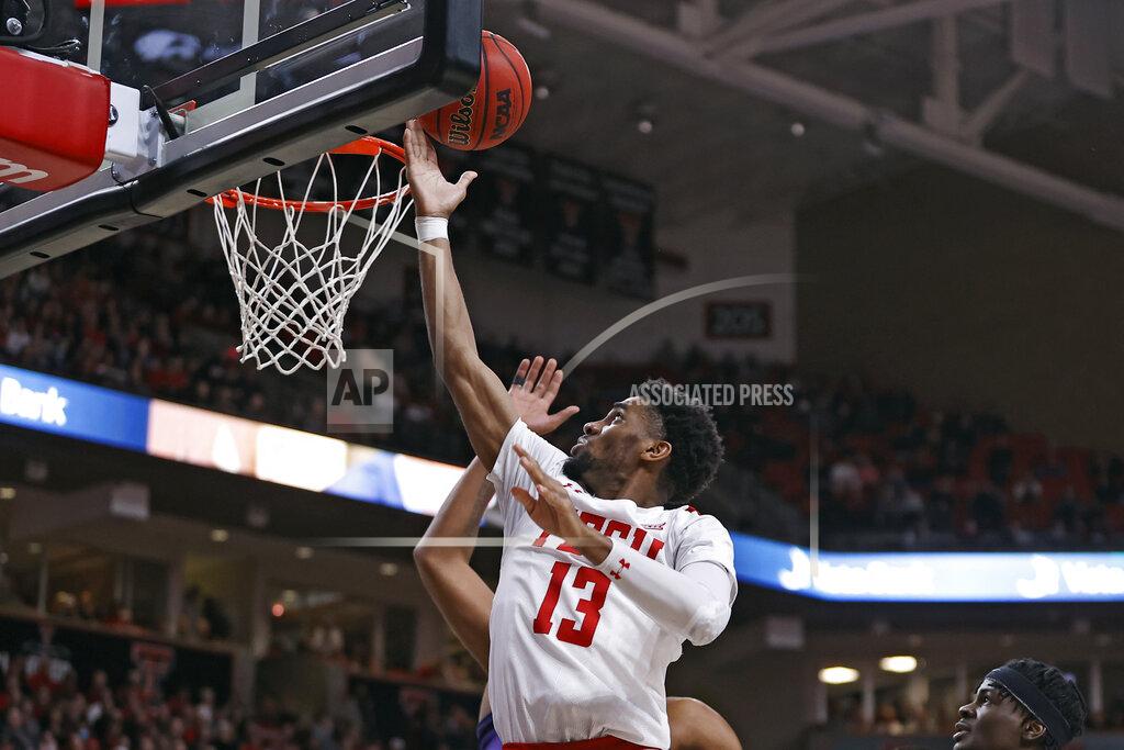 Brad Tollefson Texas Tech's Mylik Wilson (13) lays up the ball during the first half of an NCAA college basketball game against TCU, Saturday, Feb. 12, 2022, in Lubbock, Texas. (AP Photo/Brad Tollefson)