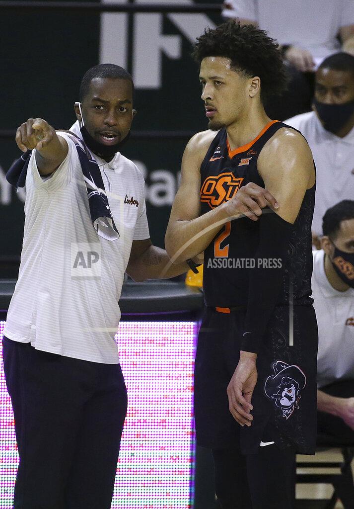 Jerry Larson Oklahoma State Mike Boynton directs Oklahoma State guard Cade Cunningham (2) in the first half of an NCAA college basketball game against Baylor, Thursday, March 4, 2021, in Waco, Texas. (AP Photo/Jerry Larson)