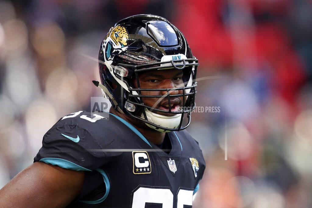 Tim Ireland FILE - In this Oct. 28, 2018, file photo, Oct. 28, 2018. Jacksonville Jaguars defensive end Calais Campbell (93) during the warm-up before an NFL football game against Philadelphia Eagles at Wembley stadium in London. Armed with a new contract after being traded from Jacksonville to Baltimore, five-time Pro Bowl defensive end hopes to be a difference-maker in the Ravens' bid to reach the Super Bowl. (AP Photo/Tim Ireland, File)