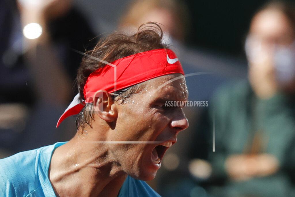 Michel Euler Spain's Rafael Nadal screams after scoring a point against Argentina's Diego Schwartzman in the semifinal match of the French Open tennis tournament at the Roland Garros stadium in Paris, France, Friday, Oct. 9, 2020. (AP Photo/Michel Euler)