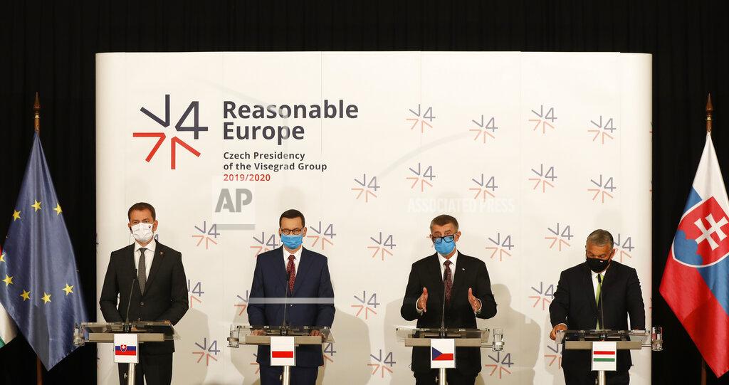Petr David Josek Prime Ministers of Slovakia Igor Matovic, left, Poland Mateusz Morawiecki, 2nd left, Czech Republic Andrej Babis, 2nd right, and Hungary Viktor Orban, right, hold a press conference after the V4 summit at the Lednice Chateau in Lednice, Czech Republic, Thursday, June 11, 2020. (AP Photo/Petr David Josek)