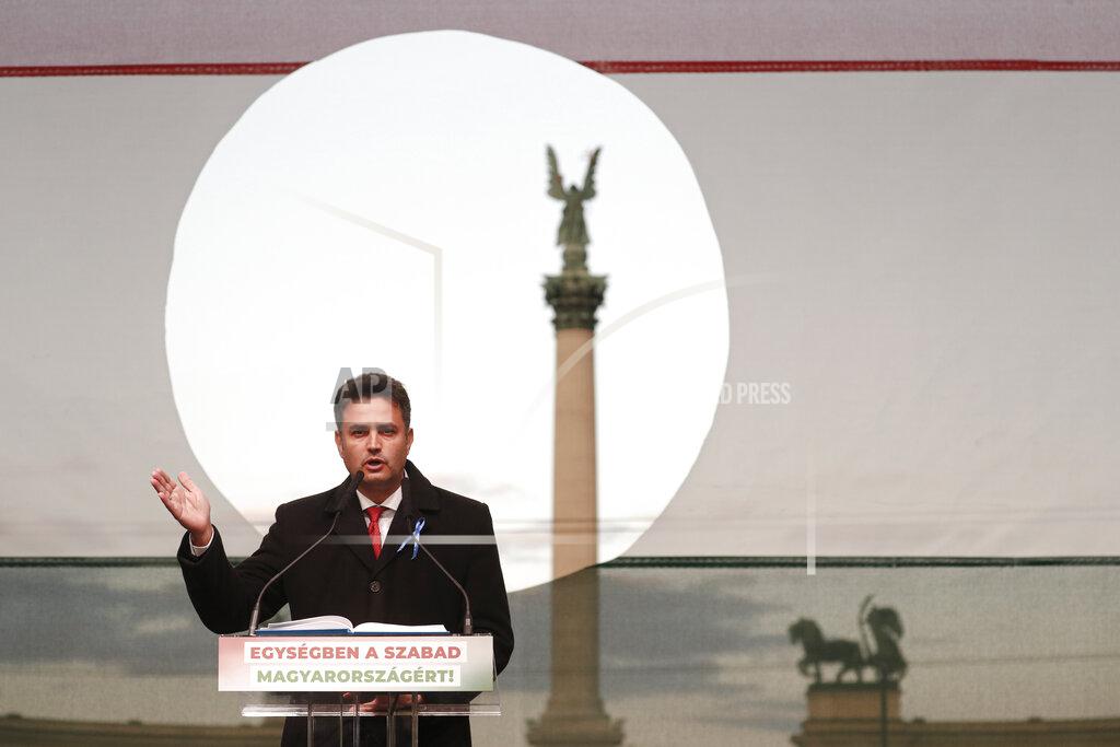Laszlo Balogh Hungarian opposition candidate Peter Marki-Zay addresses supporters during celebration the 65th anniversary of the 1956 Hungarian revolution, in Budapest, Hungary, Saturday, Oct. 23, 2021. Earlier thousands of supporters of Prime Minister Viktor Orban, who delivered a speech marking the 65th anniversary of the 1956 Hungarian revolution, marched to demonstrate loyalty to his right-wing government. (AP Photo/Laszlo Balogh)