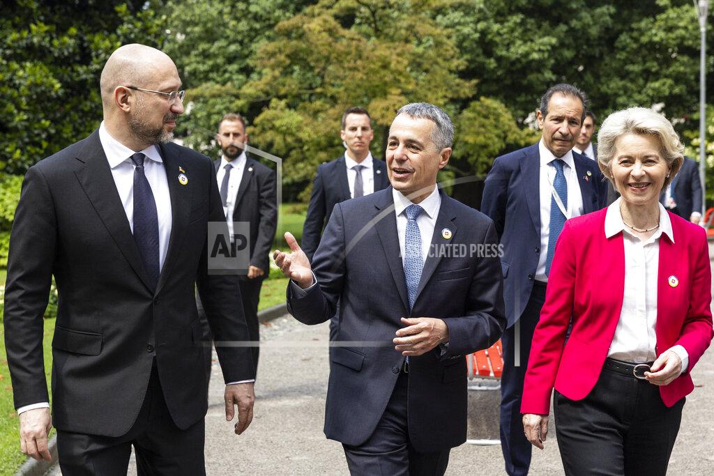 Michael Buholzer Ursula Von der Leyen, President of the European Commission, Swiss President Ignazio Cassis, Minister of Foreign Affairs, and Ukrainian Prime Minister Denys Shmyhal, from right, take a walk during the Ukraine Recovery Conference URC, Monday, July 4, 2022 in Lugano, Switzerland. The URC is organised to initiate the political process for the recovery of Ukraine after the attack of Russia to its territory. (Michael Buholzer/Keystone via AP)