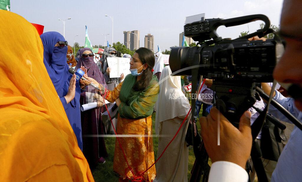Anjum Naveed In this Friday, Sept. 11, 2020 photo, Wajiha Khanian, a female journalist from local tv channel Dawn News, interviews during protest, in Islamabad, Pakistan. Social media attacks against Pakistan's women journalists have been vile and vicious, some threatening rape, others even threatening death and the culprits are most often allied to the ruling party, even prompting the Committee to Protect Journalists to issue a statement on Friday condemning the relentless attacks. (AP Photo/Anjum Naveed)
