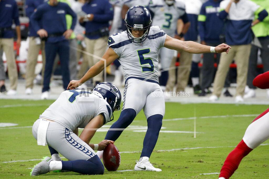Ross D. Franklin Seattle Seahawks kicker Jason Myers (5) kiss a field goal as punter Michael Dickson (4) holds during the first half of an NFL football game against the Arizona Cardinals, Sunday, Sept. 29, 2019, in Glendale, Ariz. (AP Photo/Ross D. Franklin)