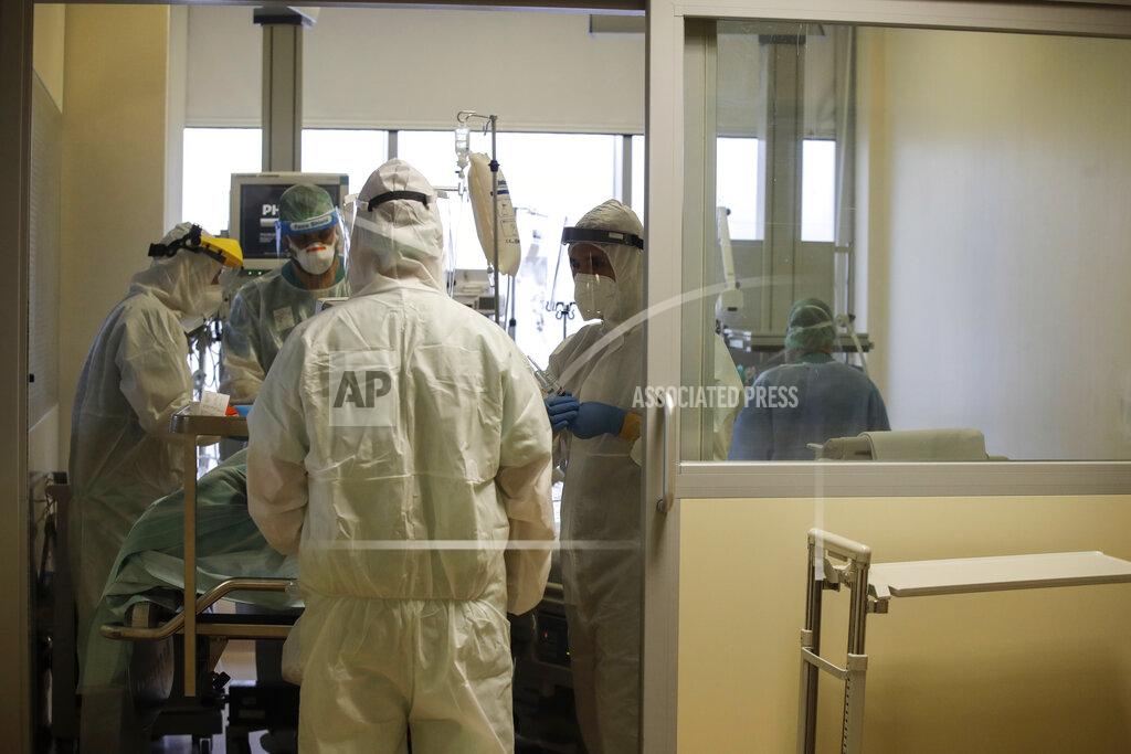 Luca Bruno Doctors tend to a coronavirus patient in the Intensive Care Unit at the Varese’s Circolo Hospital, in Varese, Italy, Friday, Nov. 6, 2020. During Italy's autumn pandemic resurgence, concern is falling less on intensive care wards and more on regular medical wards, as eight regions have seen the needle move alarmingly into the red-alert zone with more than half of hospital beds dedicated to coronavirus patients. (AP Photo/Luca Bruno)