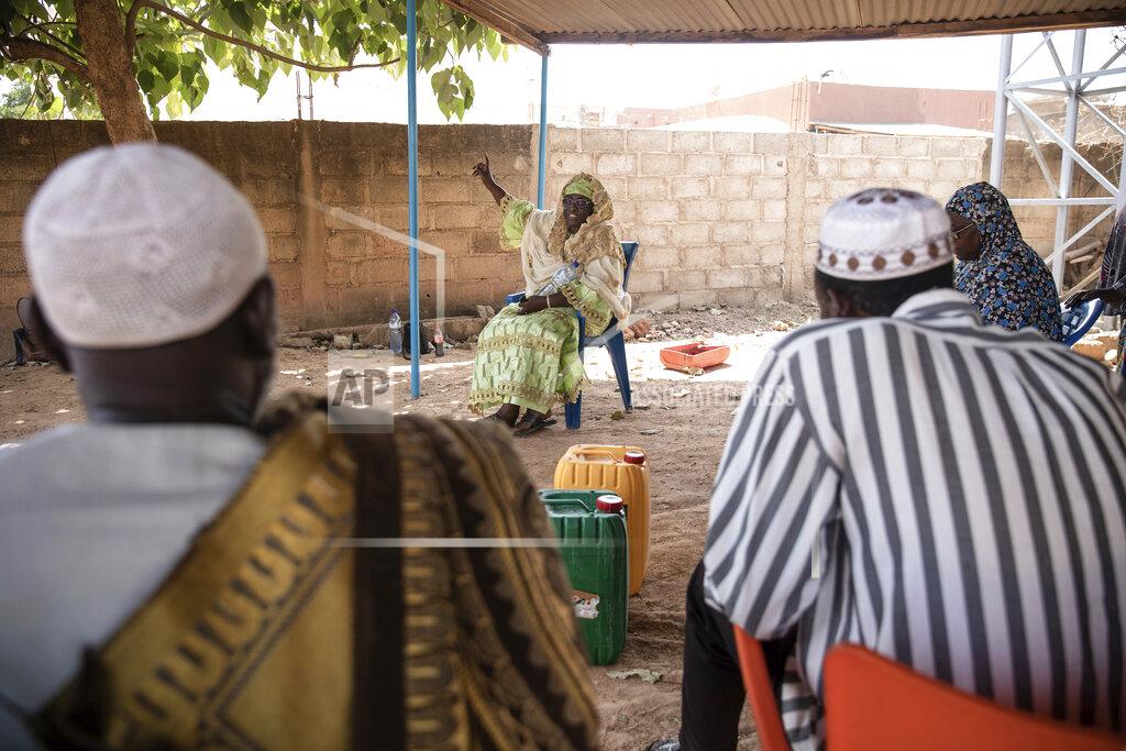 Sophie Garcia Zenabou Coulibaly Zongo, consultant and founding member of the Council of Burkinabe Women, speaks as she distributes soap to a mosque in Ouagadougou, Burkina Faso, Wednesday, Oct. 27, 2021. Zongo spends her own money making soap and buying hand sanitizer for mosques, markets and health centers. At the start of the pandemic, Zongo, now 63, was hospitalized with bronchial pneumonia. She paid out of pocket for two weeks' worth of oxygen treatments at a private clinic, where she watched others die from respiratory problems. (AP Photo/Sophie Garcia)